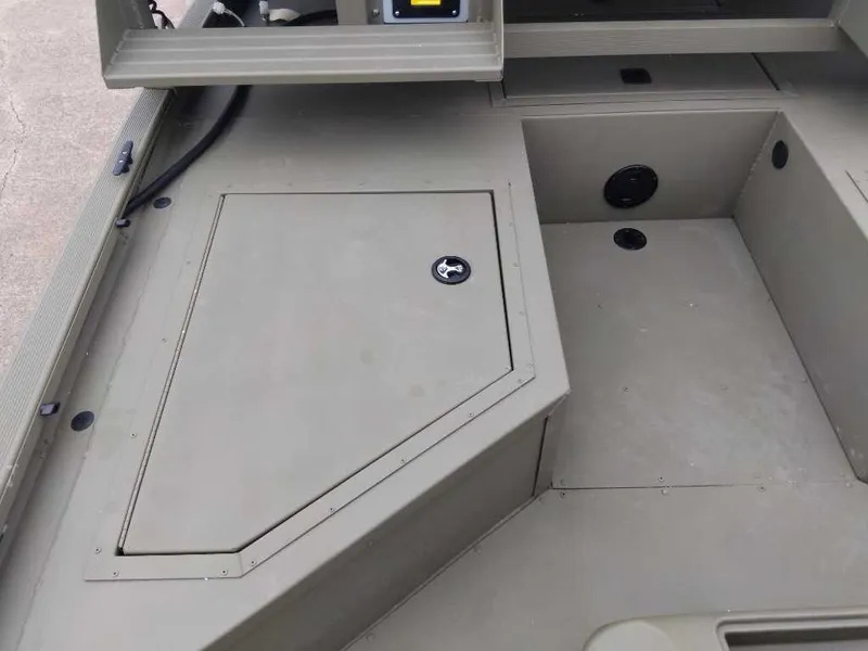 Slide: The Image of 2024 Tracker Grizzly 2072 CC Sportsman boat interior storage compartment. - 6
