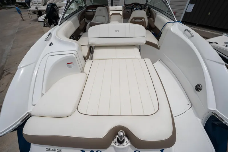 Slide: The Image of 2011 Cobalt 242 boat with white and beige interior seating. - 12