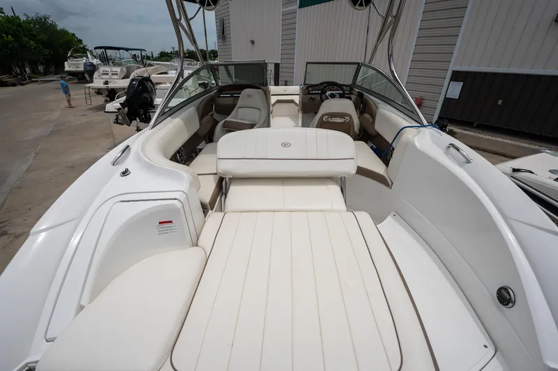 Slide: The Image of 2011 Cobalt 242 boat with white interior and spacious seating. - 13