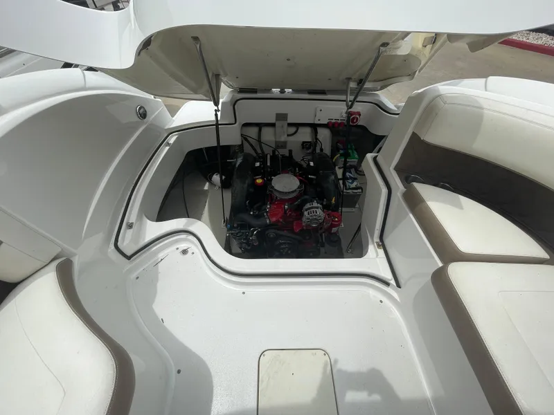 Slide: The Image of 2011 Cobalt 242 boat engine compartment with open hatch. - 26