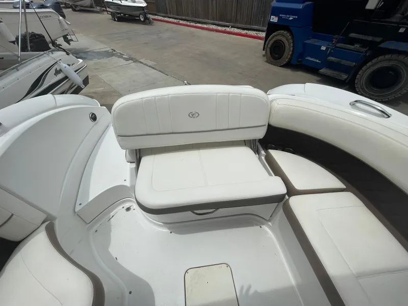 Slide: The Image of 2011 Cobalt 242 boat interior with white seating. - 27