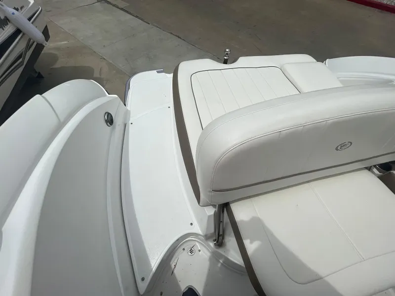 Slide: The Image of 2011 Cobalt 242 boat with white leather seating and deck. - 36