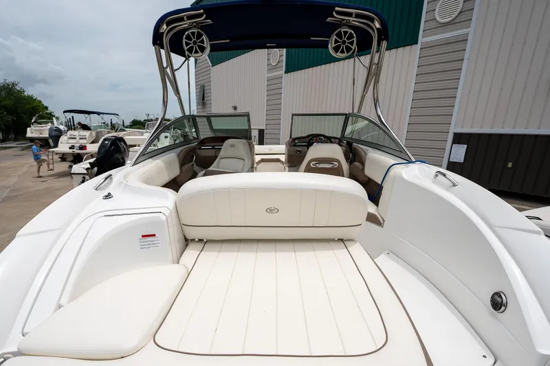 Slide: The Image of 2011 Cobalt 242 boat with spacious seating and sleek design. - 9