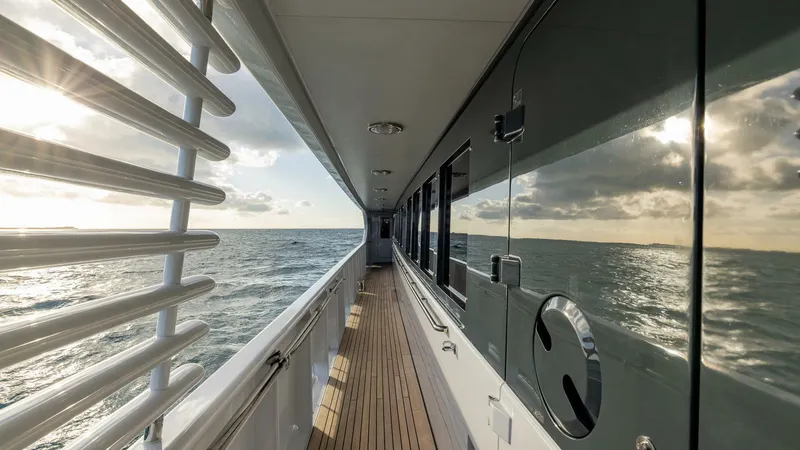 Slide: The Image of Side deck view of 2003 Feadship 51.8M yacht cruising on the ocean. - 13