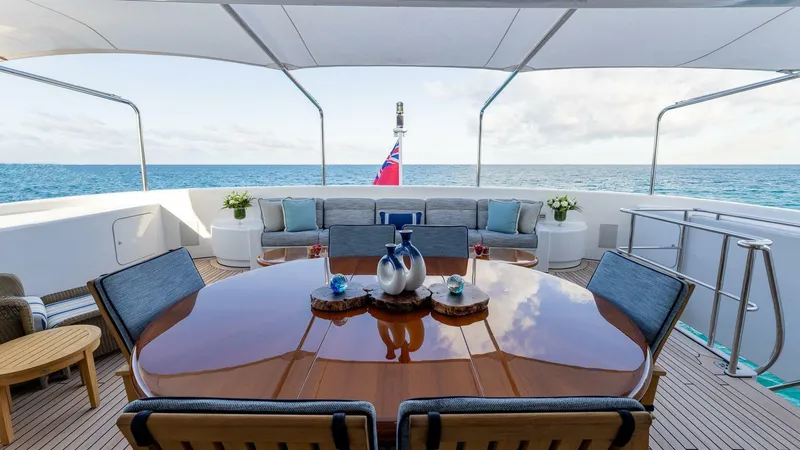 Slide: The Image of Luxurious deck of 2003 Feadship 51.8M yacht with ocean view and elegant seating. - 17