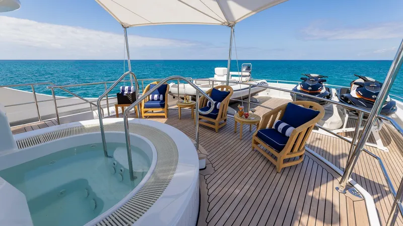 Slide: The Image of Luxury deck of 2003 Feadship 51.8M yacht with hot tub and ocean view. - 30