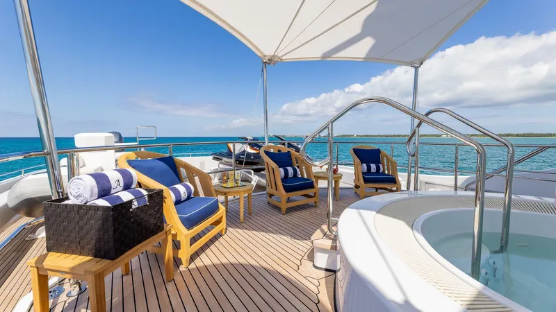 Slide: The Image of Luxurious deck of 2003 Feadship 51.8M yacht with hot tub and ocean view. - 31