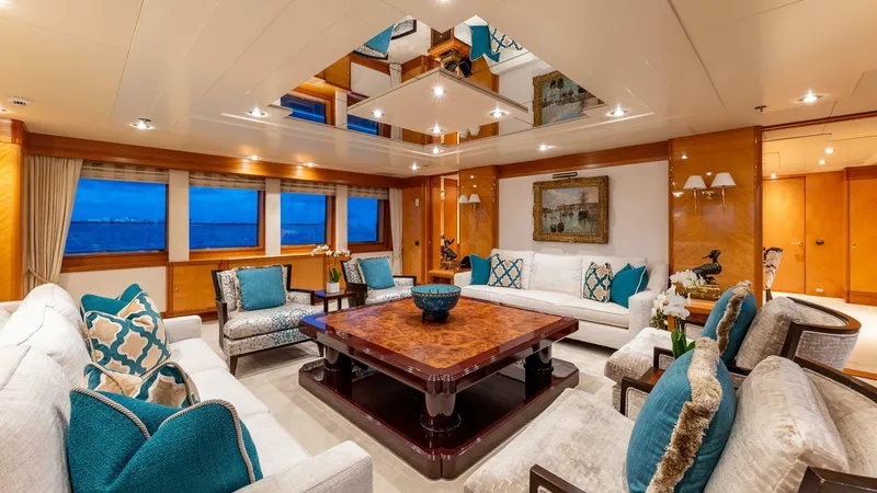 Slide: The Image of Luxurious interior of 2003 Feadship 51.8M yacht with elegant seating and wooden accents. - 39