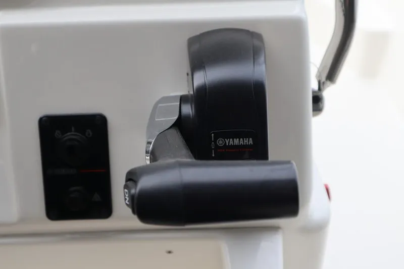 Slide: The Image of Close-up of Yamaha throttle control on 2024 Key West 179FS boat. - 13