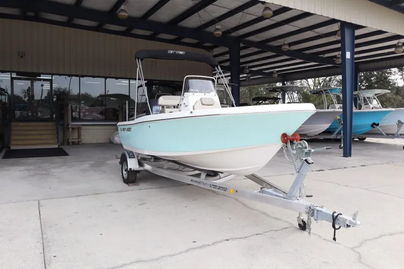 Slide: The Image of 2024 Key West 179FS boat on a trailer at a dealership. - 3