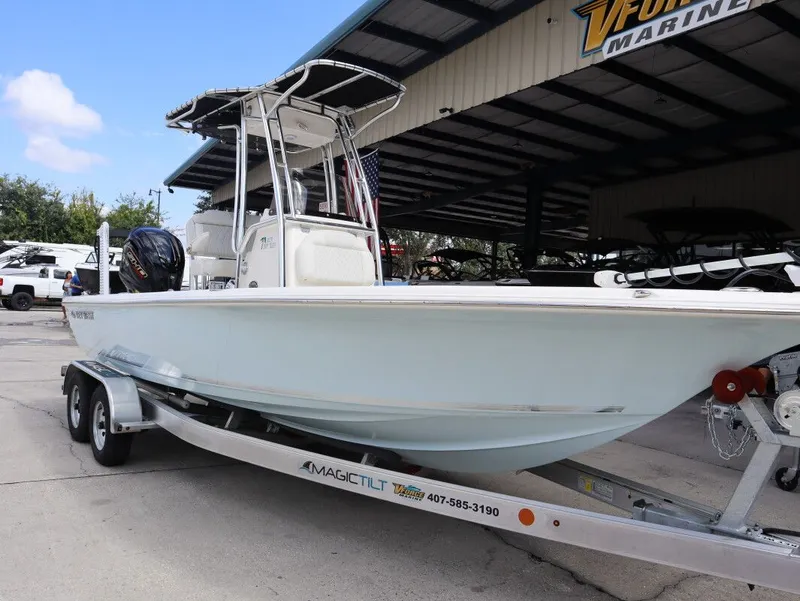 Slide: The Image of 2025 Key West Bay Reef 230BR on trailer outdoors. - 1