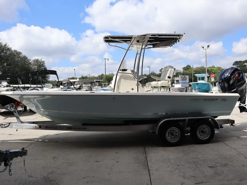 Slide: The Image of 2025 Key West Bay Reef 230BR boat on trailer at VForce Marine. - 2