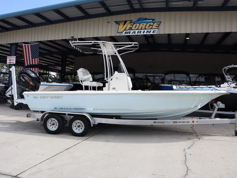 Slide: The Image of 2025 Key West Bay Reef 230BR boat on trailer outdoors. - 3