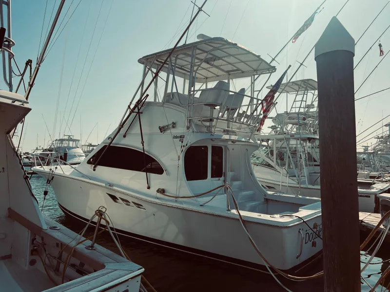 The Image of 1999 Luhrs 360 Sportfish boat docked at a marina. - 1