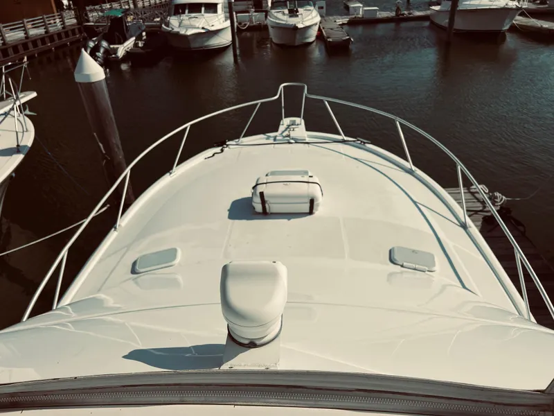 Slide: The Image of 1999 Luhrs 360 Sportfish boat docked at a marina, top deck view. - 6