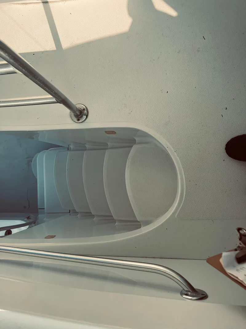 Slide: The Image of 1999 Luhrs 360 Sportfish boat deck with steps and railing. - 9