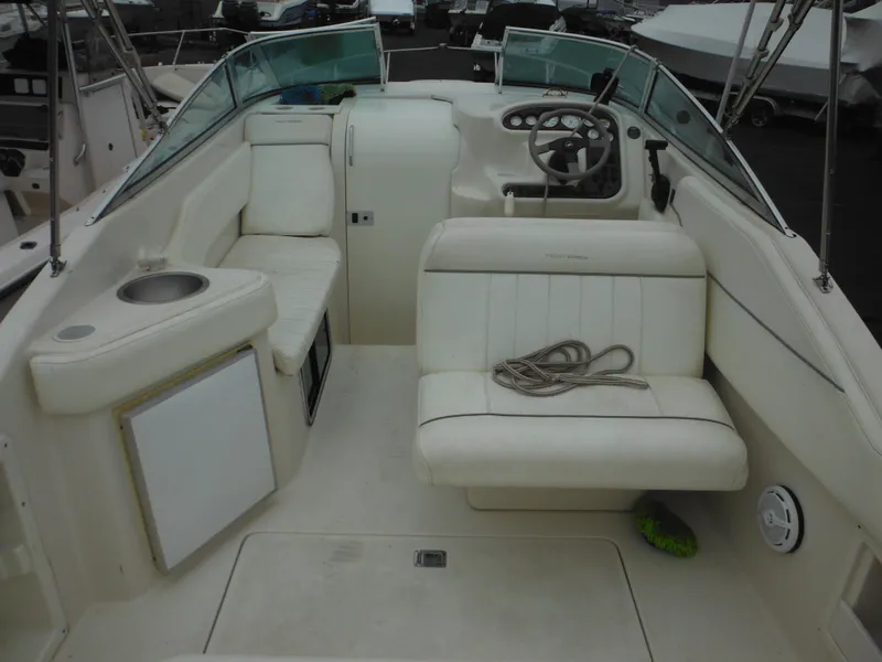 Slide: The Image of 1999 Monterey 262 Cruiser boat interior with seating and steering wheel. - 11