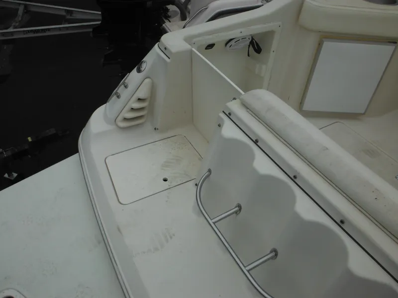 Slide: The Image of 1999 Monterey 262 Cruiser boat deck and seating area. - 13
