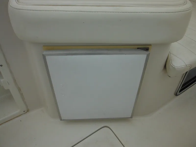 Slide: The Image of 1999 Monterey 262 Cruiser interior seating and storage compartment. - 14