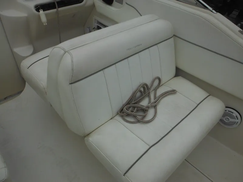 Slide: The Image of 1999 Monterey 262 Cruiser boat interior seating with rope. - 15