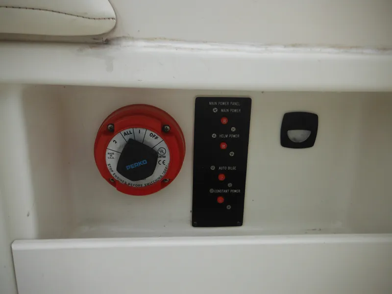 Slide: The Image of 1999 Monterey 262 Cruiser control panel with Perko switch and indicator lights. - 20