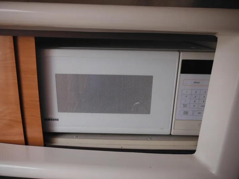 Slide: The Image of Built-in microwave in 1999 Monterey 262 Cruiser boat kitchen. - 30