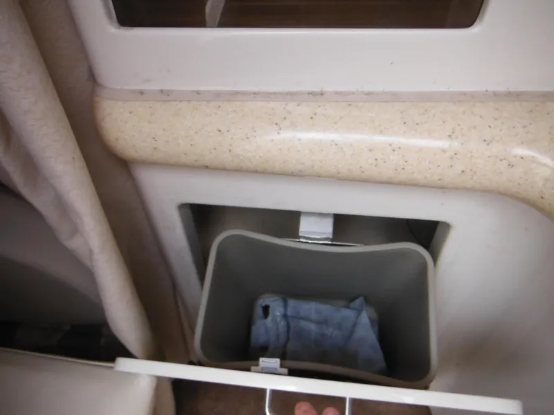 Slide: The Image of Built-in trash bin in 1999 Monterey 262 Cruiser boat interior. - 33
