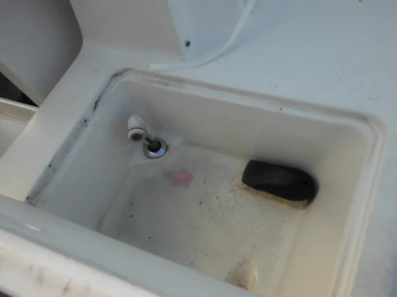 Slide: The Image of 1999 Monterey 262 Cruiser sink with faucet and cleaning brush. - 42