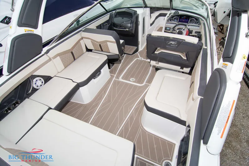 Slide: The Image of 2024 Monterey 278 SS boat interior with spacious seating and modern dashboard. - 27