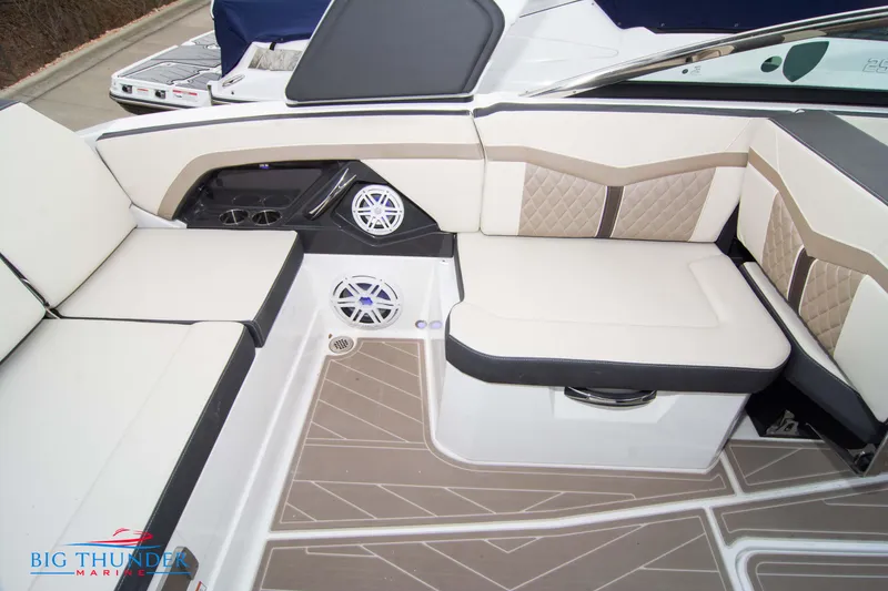 Slide: The Image of 2024 Monterey 278 SS boat interior with beige seating and built-in speakers. - 29