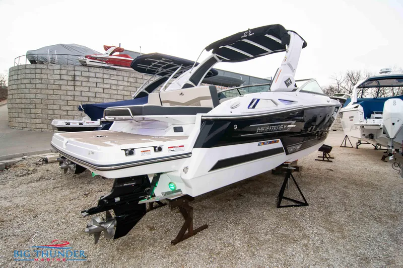 Slide: The Image of 2024 Monterey 278 SS boat on display in a marina. - 3