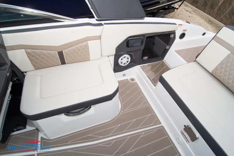 Slide: The Image of 2024 Monterey 278 SS boat interior with beige and white seating. - 31