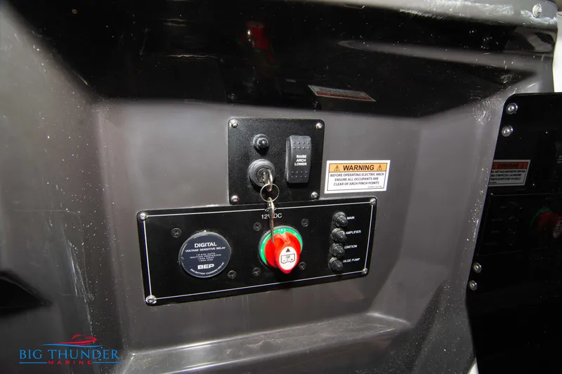 Slide: The Image of Control panel of a 2024 Monterey 278 SS boat with ignition key and digital display. - 32