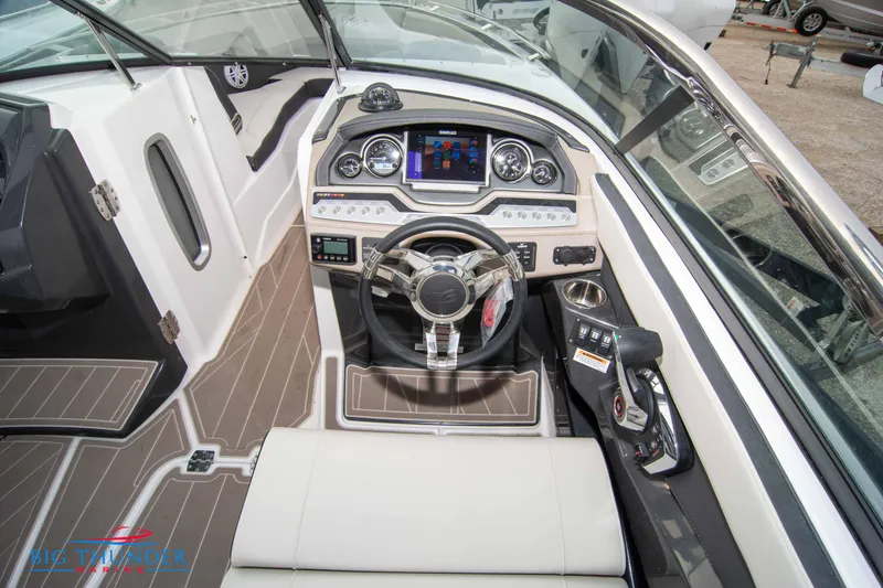Slide: The Image of 2024 Monterey 278 SS boat cockpit with modern dashboard and steering wheel. - 37