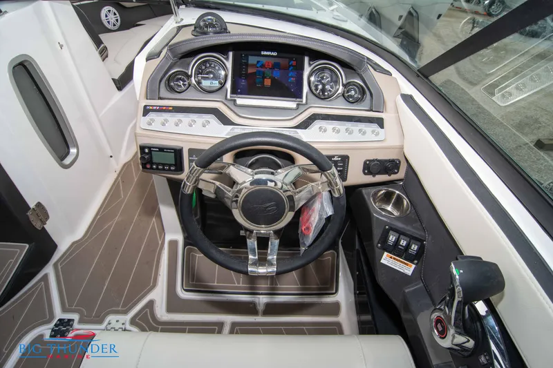 Slide: The Image of 2024 Monterey 278 SS boat dashboard with steering wheel and control panel. - 38