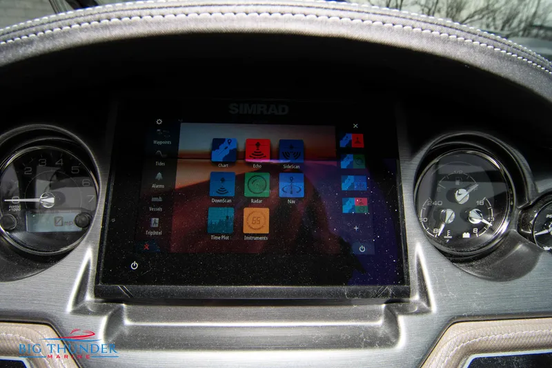 Slide: The Image of 2024 Monterey 278 SS dashboard with Simrad display and gauges. - 40