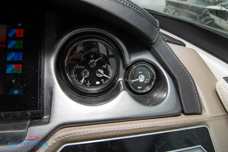 Slide: The Image of Close-up of 2024 Monterey 278 SS boat dashboard gauges. - 42
