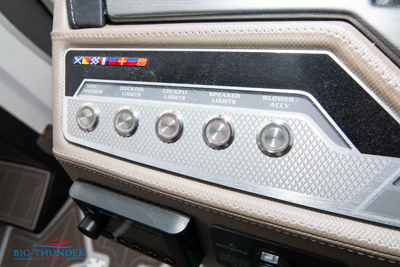 Slide: The Image of Control panel of the 2024 Monterey 278 SS boat with various switches. - 43