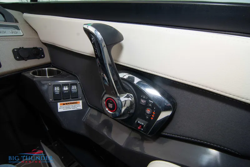 Slide: The Image of 2024 Monterey 278 SS boat control panel with throttle lever and switches. - 48