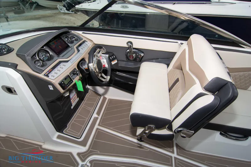Slide: The Image of 2024 Monterey 278 SS boat interior with modern dashboard and comfortable seating. - 49