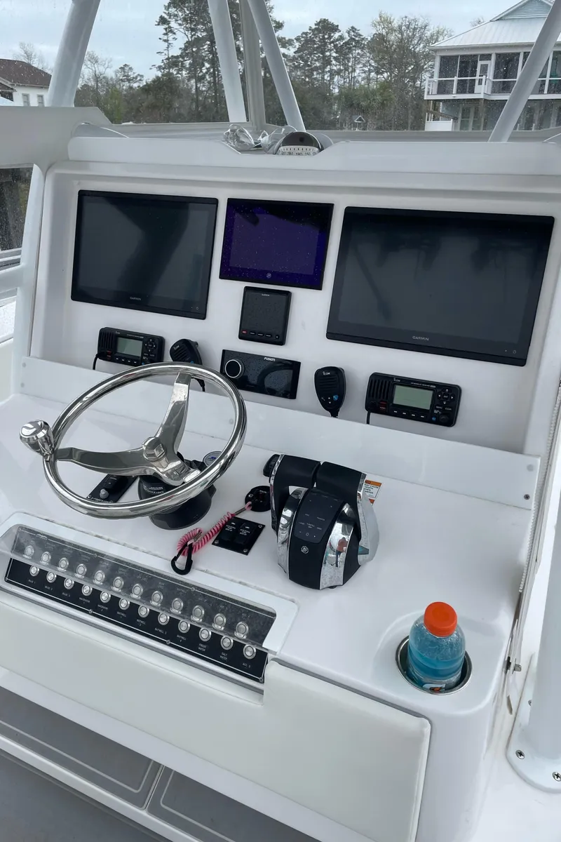 Slide: The Image of 2022 Invincible 36 Open Fisherman helm with advanced navigation systems and controls. - 14