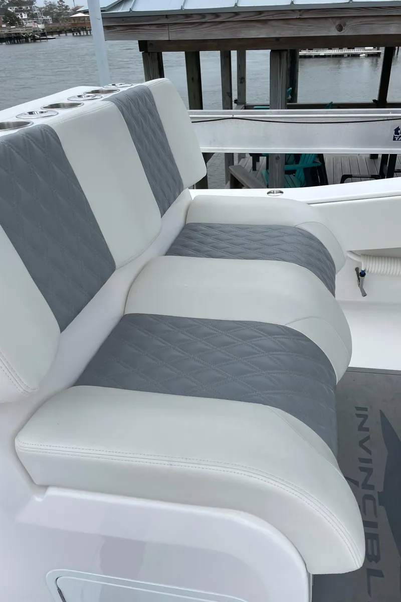 Slide: The Image of 2022 Invincible 36 Open Fisherman boat with cushioned seating. - 2