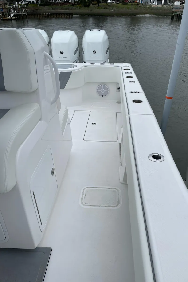 Slide: The Image of 2022 Invincible 36 Open Fisherman boat deck with triple outboard engines. - 5