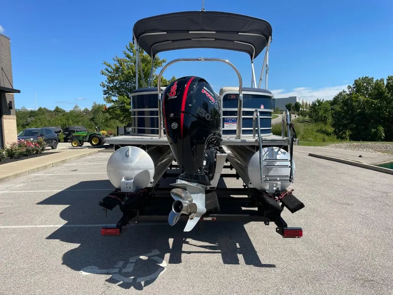 Slide: The Image of 2022 South Bay 224 RS pontoon boat with outboard motor in parking lot. - 5