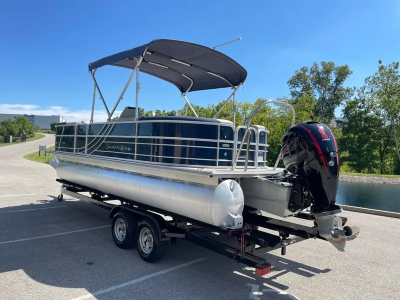 Slide: The Image of 2022 South Bay 224 RS pontoon boat on a trailer with a canopy. - 6