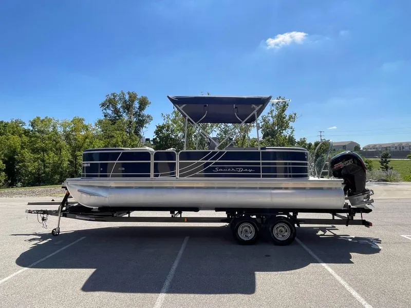 Slide: The Image of 2022 South Bay 224 RS pontoon boat on trailer in parking lot. - 7