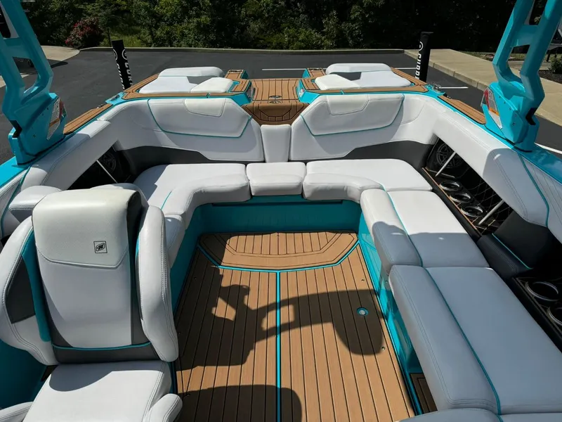 Slide: The Image of 2017 Nautique Super Air Nautique GS22 interior with white seating and teak flooring. - 11