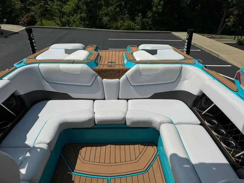 Slide: The Image of 2017 Nautique Super Air Nautique GS22 interior with white seating and teak flooring. - 13