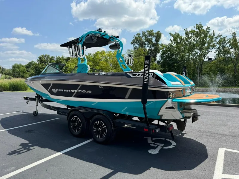 Slide: The Image of 2017 Nautique Super Air Nautique GS22 boat on trailer, parked outdoors. - 6