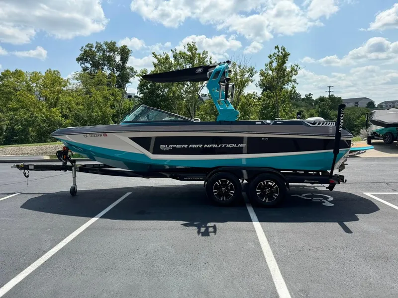 Slide: The Image of 2017 Nautique Super Air Nautique GS22 boat on trailer in parking lot. - 7